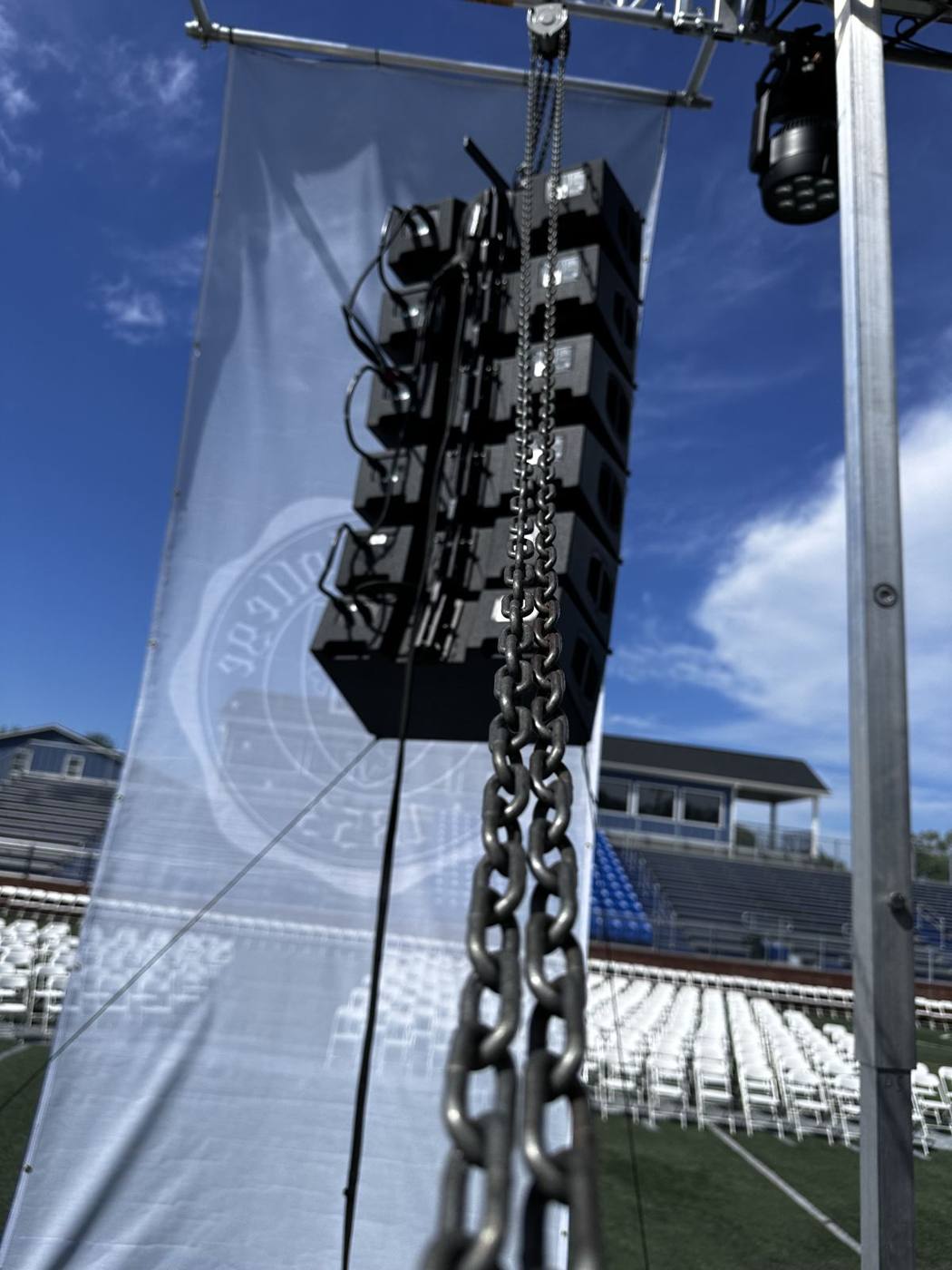 Line array hung from a chain hoist on the SL100