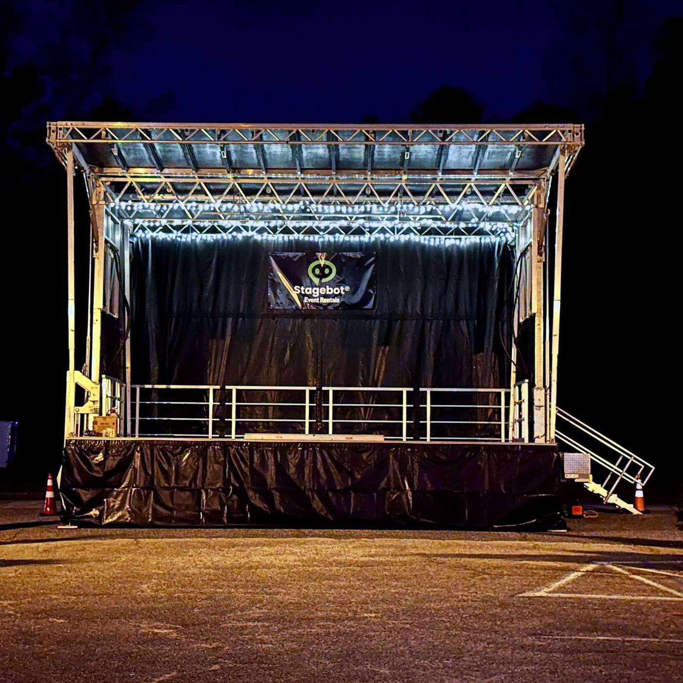 The SL100 at night, front view, with the Stagebot banner