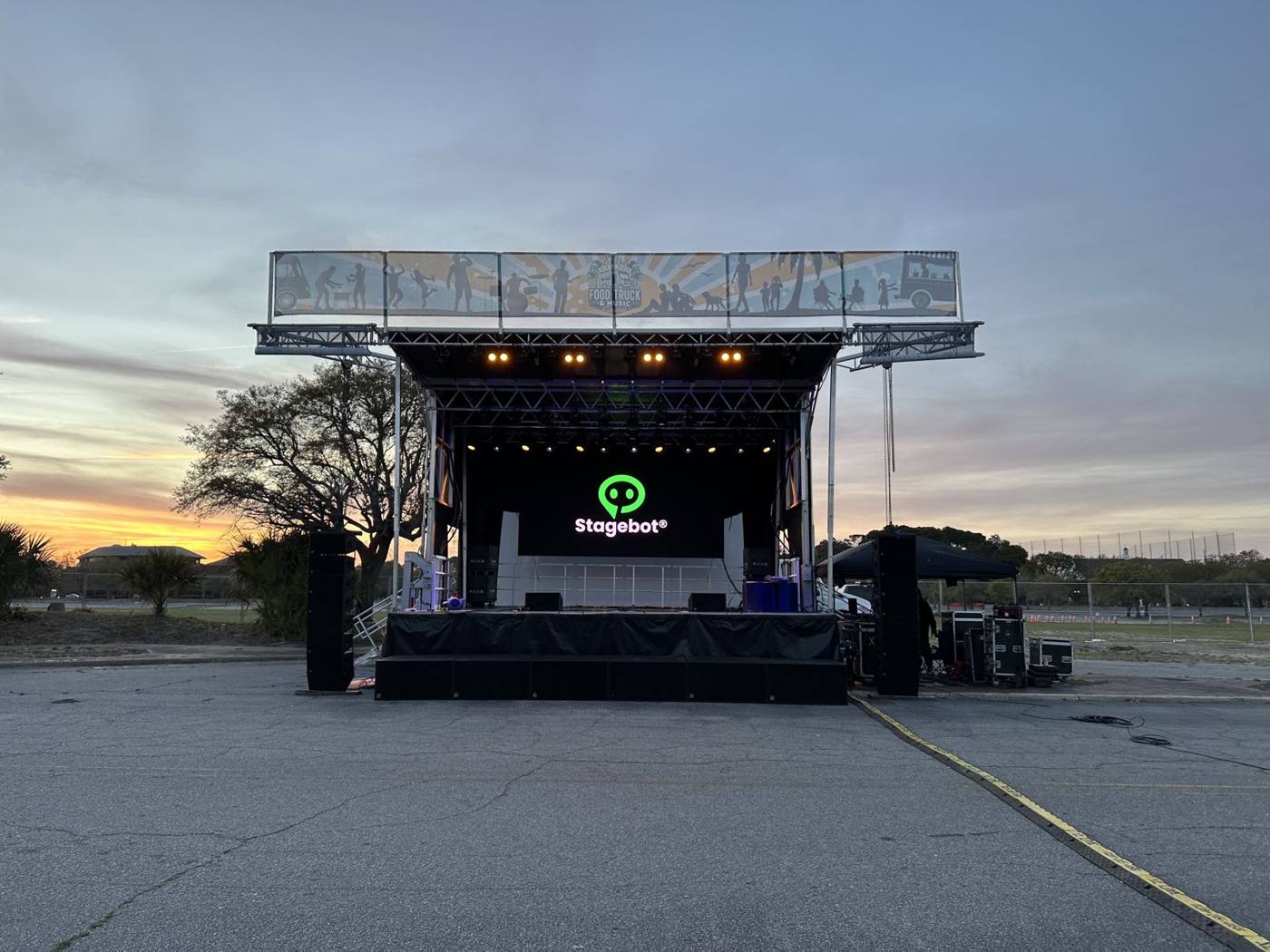 Jolene at sunset with the Stagebot logo on the LED wall