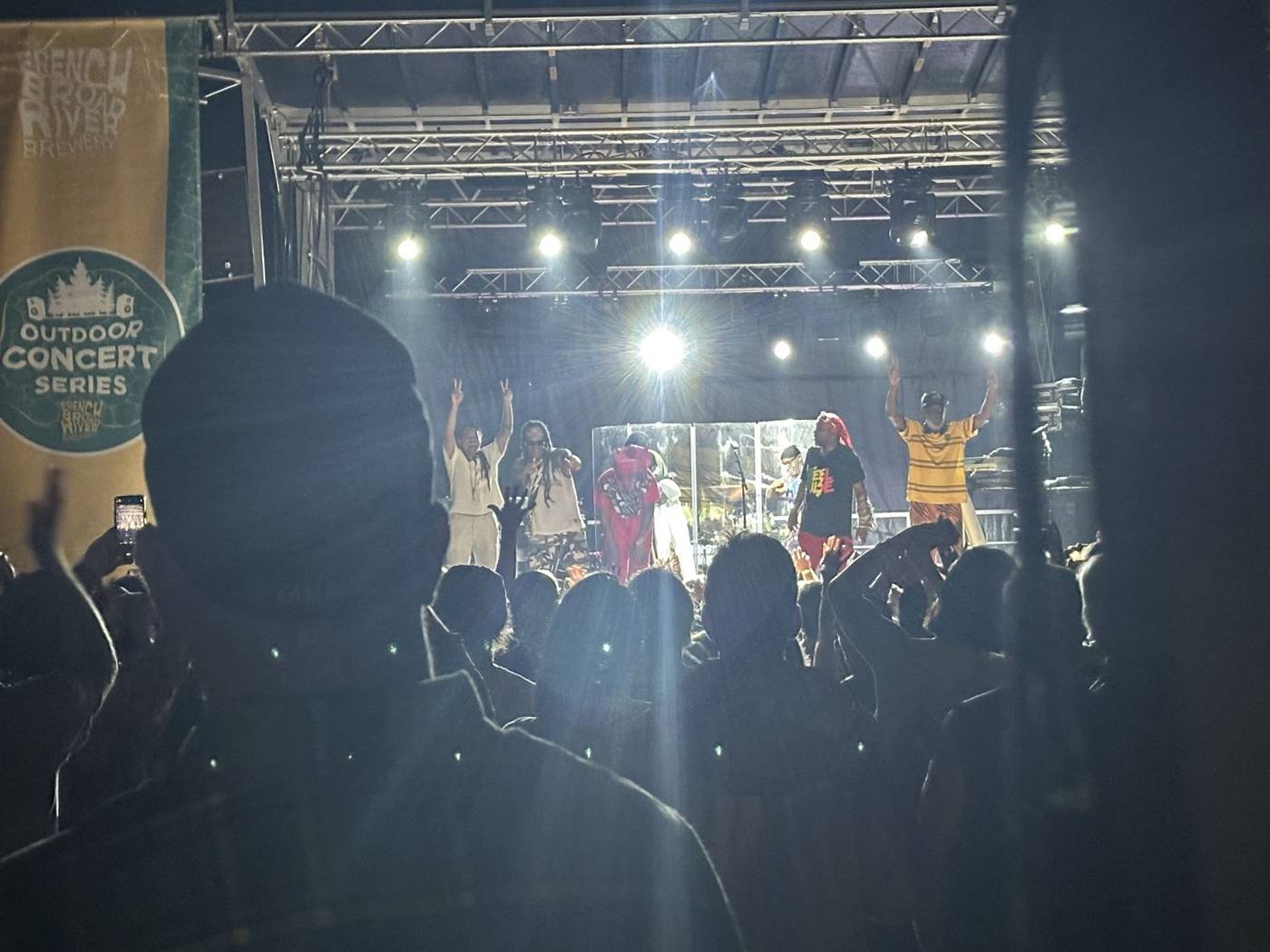 Crowd with hands up for a headliner at the Outdoor Concert Series